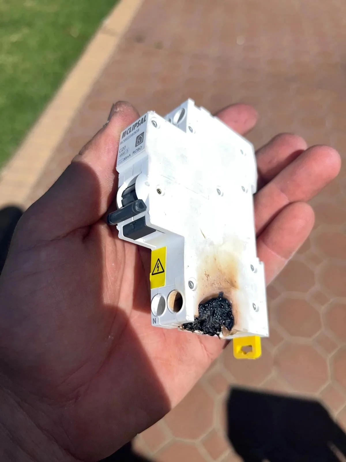 A safety switch that has burnt out inside a switchboard