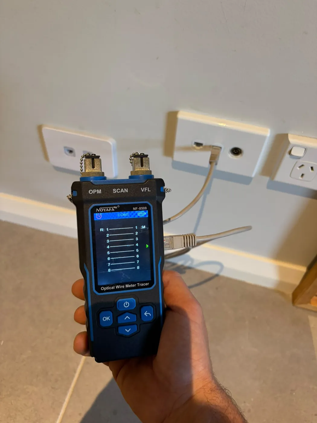 A data point being tested with a cable tester after installation by C3 Industries